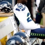 Seahawks' Jeremy Lane sits during national anthem before game in Oakland