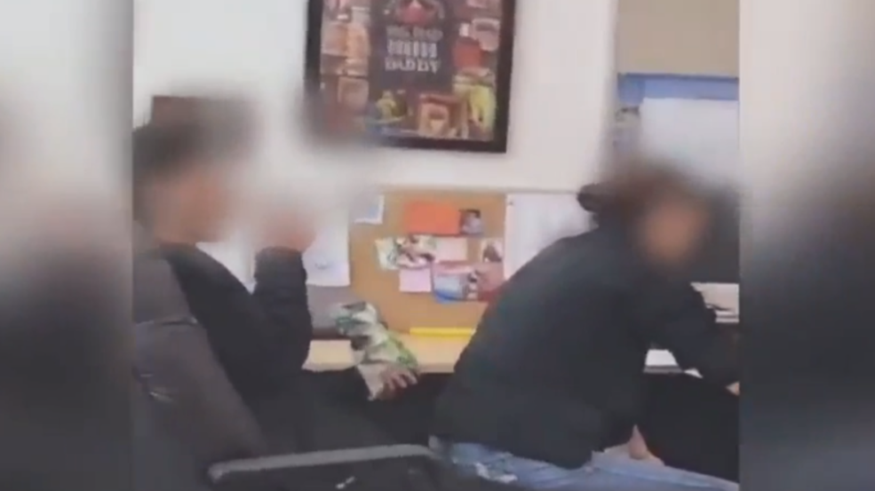 Video shows teacher aide sit on male high school student